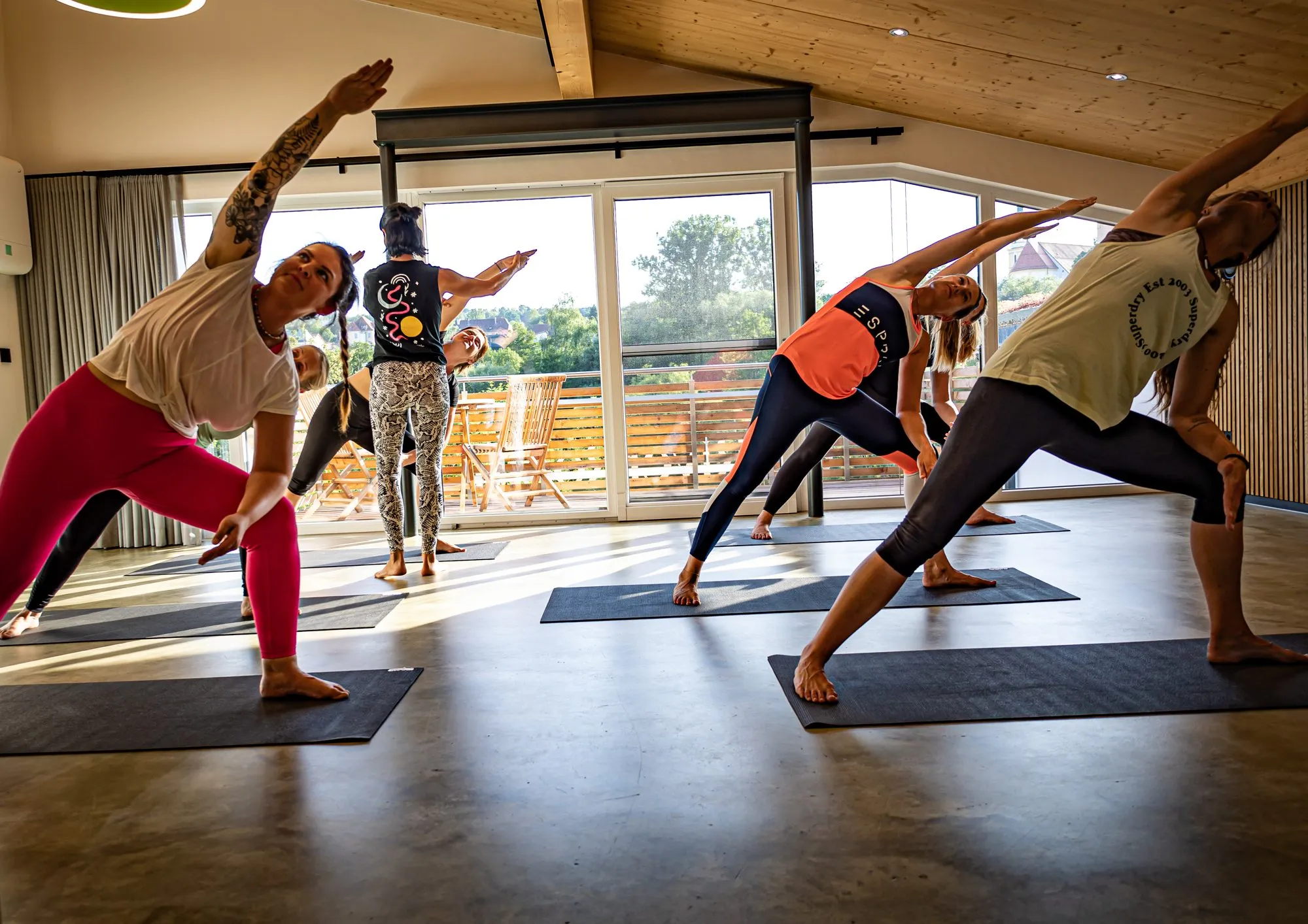 A flowing yoga practice in the warm light of the RiverRoom